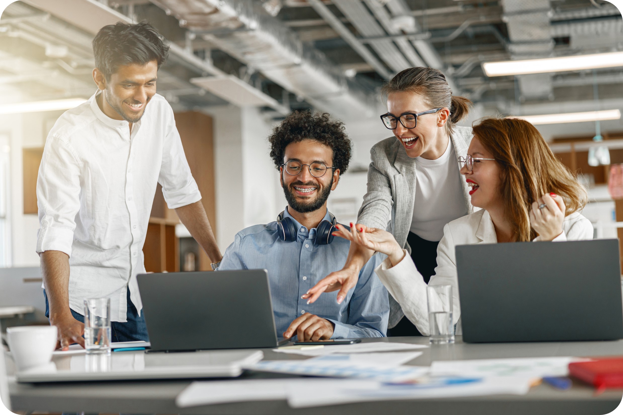 A team looking at results and showing excitement. CREDIT: https://www.istockphoto.com/portfolio/KostiantynVoitenko