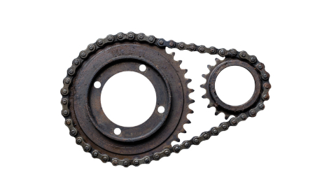 A large gear and a small gear connected by a chain. Credit: Michal Kin