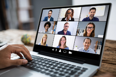 An online meeting screen of people's faces. Credit: https://www.istockphoto.com/au/portfolio/andreypopov