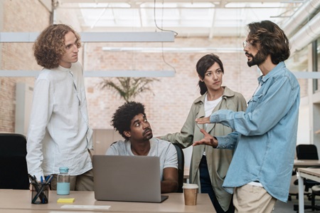 Young professionals discussing new ideas and strategy. Credit https://www.istockphoto.com/portfolio/EduardFigueres