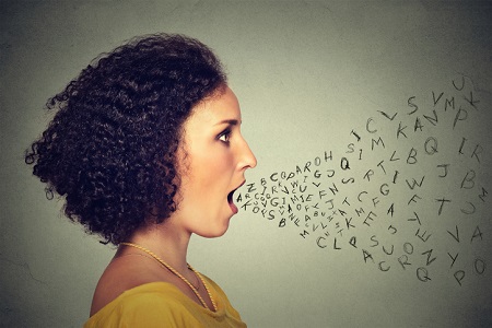 Woman talking with alphabet letters coming out of mouth. Credit: https://www.istockphoto.com/portfolio/SIphotography